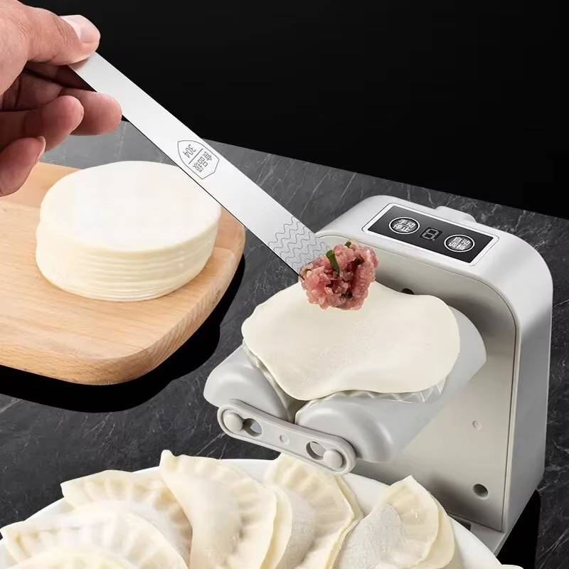 Automatic Dumpling Maker Machine Kitchen Appliance

Rewritten title:  
Automatic Dumpling Maker Machine Food Preparation Appliance